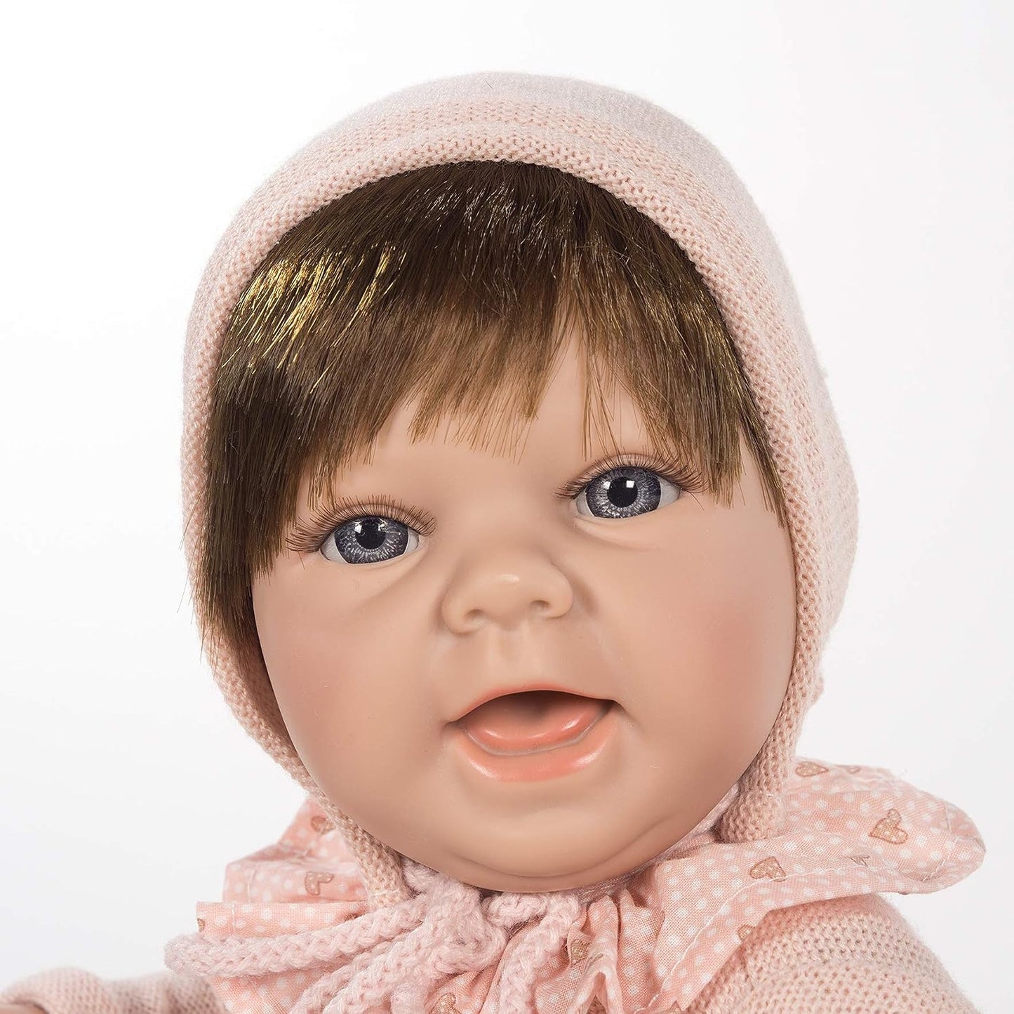 Baby girl in pink smiling