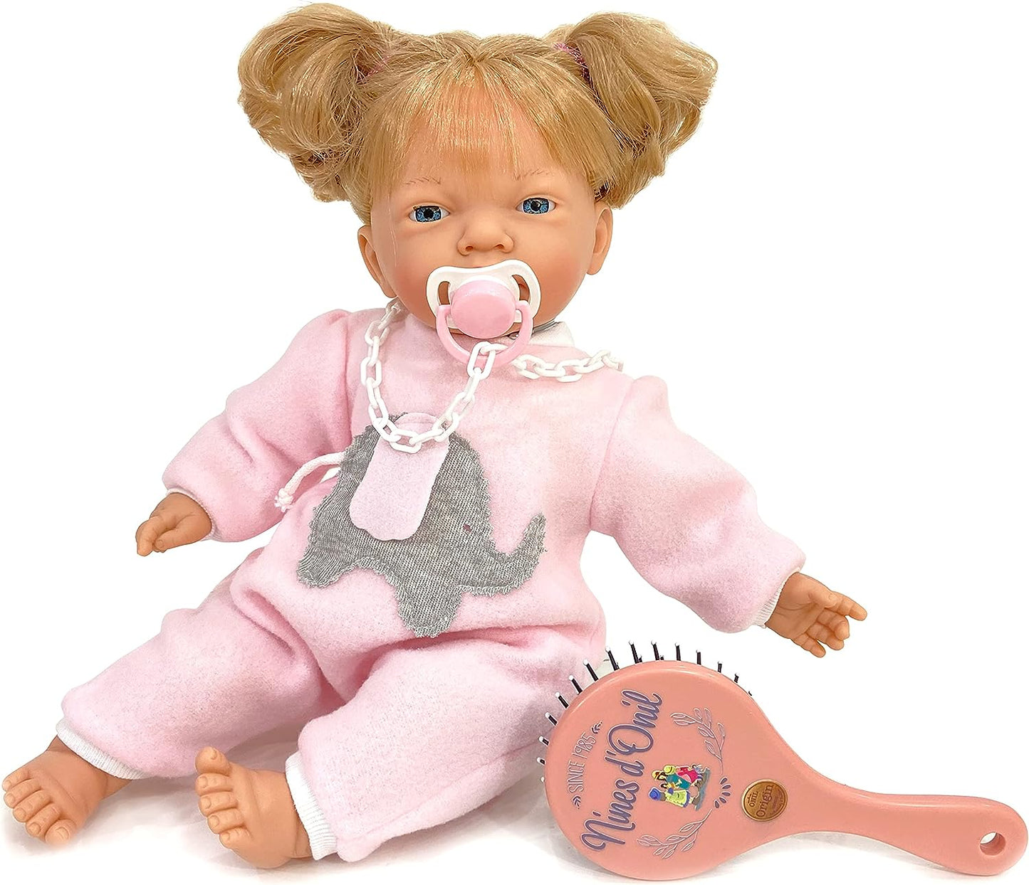 Nines Artesanals d'Onil in pink dress